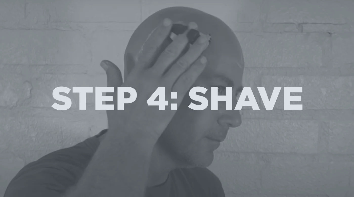 man shaving his head
