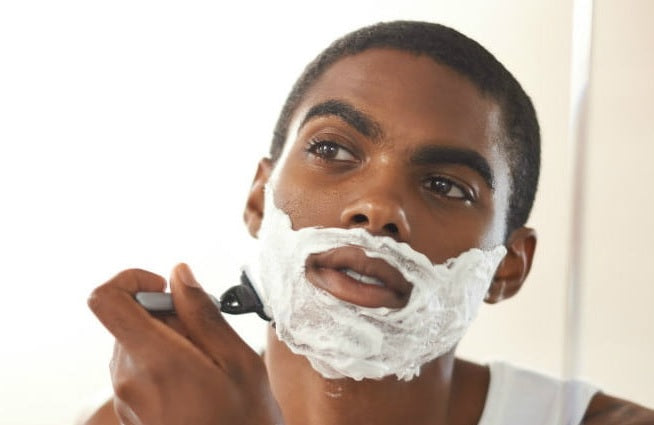black man shaving