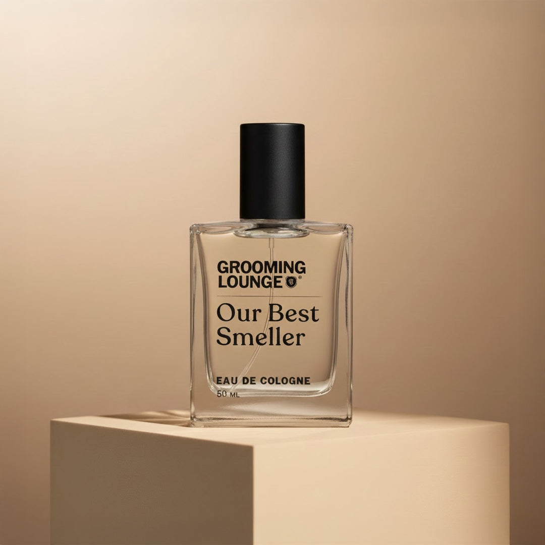 Perfume bottle labeled 'Our Best Smeller' by Grooming Lounge on a beige background
