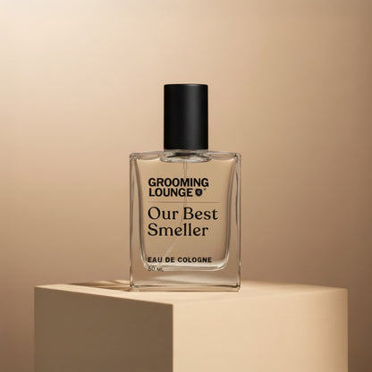 Perfume bottle labeled 'Our Best Smeller' by Grooming Lounge on a beige background